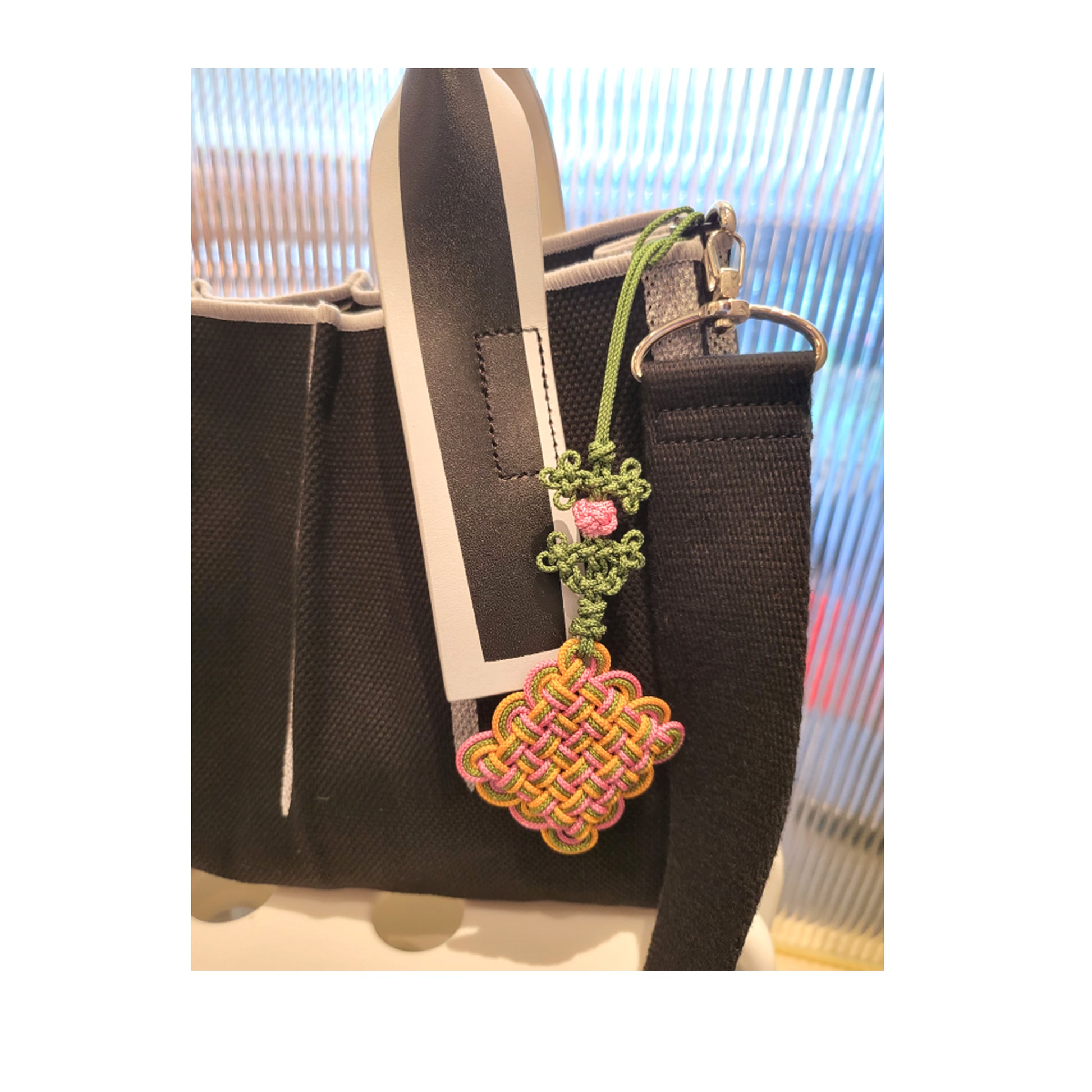 Korea Traditional Knot  keychain hanging from a bag. beautiful and unique charm